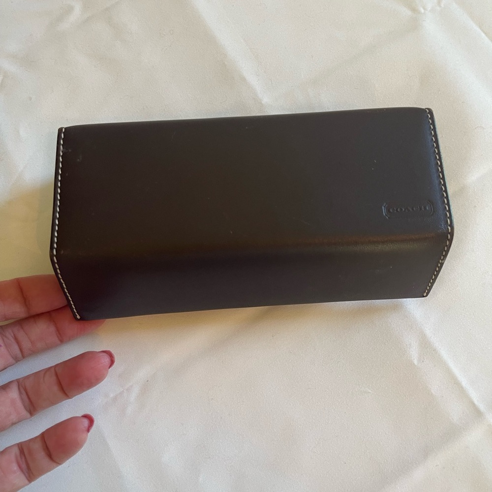 Coach eye glass case, leather exterior with cloth interior.